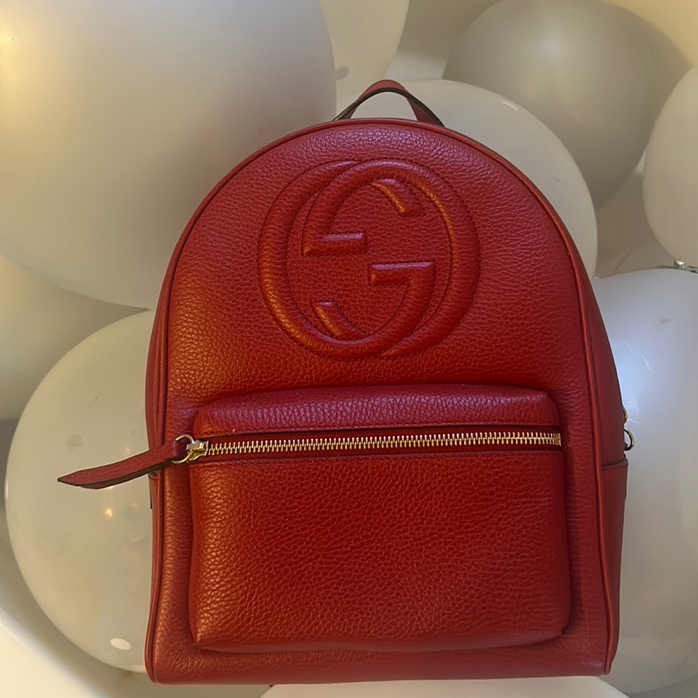 Beautiful red vibrant Gucci backpack. Sure to leave a lasting impression.